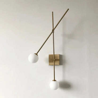 Minimalist brass opal-glass bubble bedroom sconce with two white globes Decorbites on Tampa Home & Garden Store