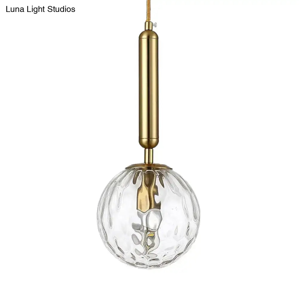 Black Gold Glass Globe Wall Sconce with brass finish and clear textured glass globe on Tampa Home & Garden Store