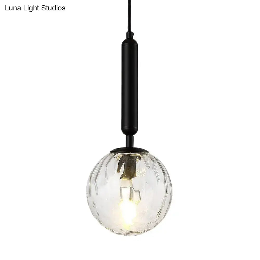 Black Gold Glass Globe Wall Sconce with clear ribbed globe and black hardware on Tampa Home & Garden Store