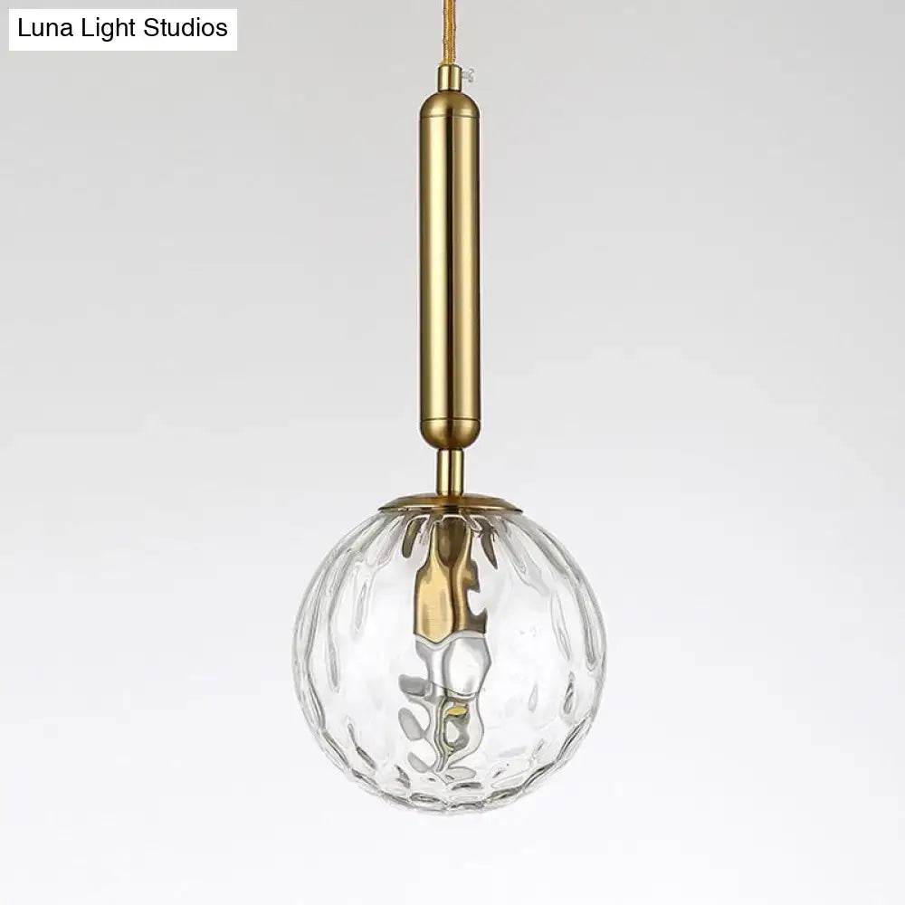 Black Gold Glass Globe Wall Sconce with clear ribbed glass globe and brass finish on Tampa Home & Garden Store