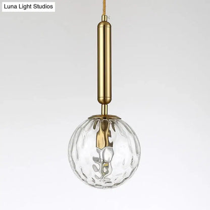 Black Gold Glass Globe Wall Sconce with clear ribbed glass globe and brass finish on Tampa Home & Garden Store