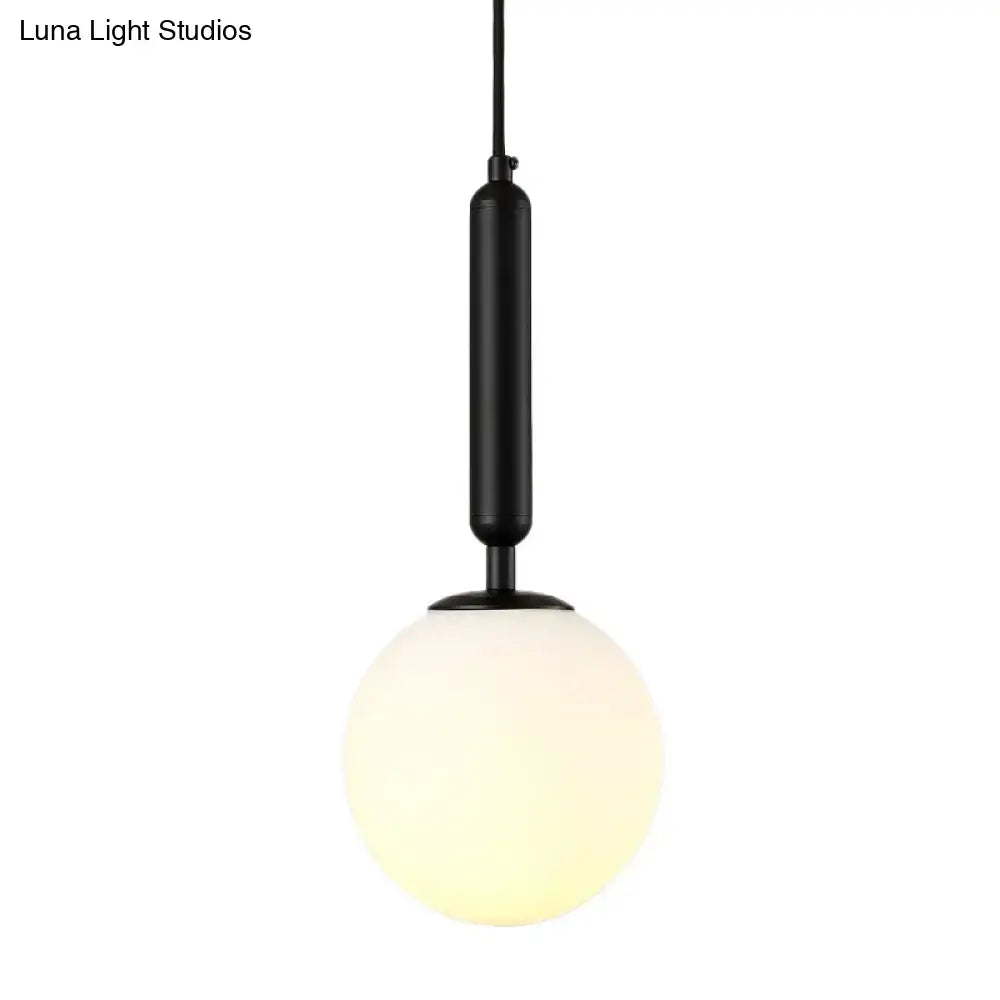 Black Gold Glass Globe Wall Sconce by Decorbites with black metal stem and frosted globe on Tampa Home & Garden Store