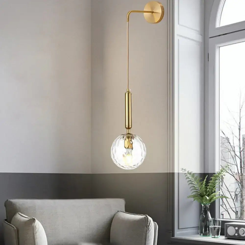Black Gold Glass Globe Wall Sconce by Decorbites with brass arm and clear glass globe on Tampa Home & Garden Store