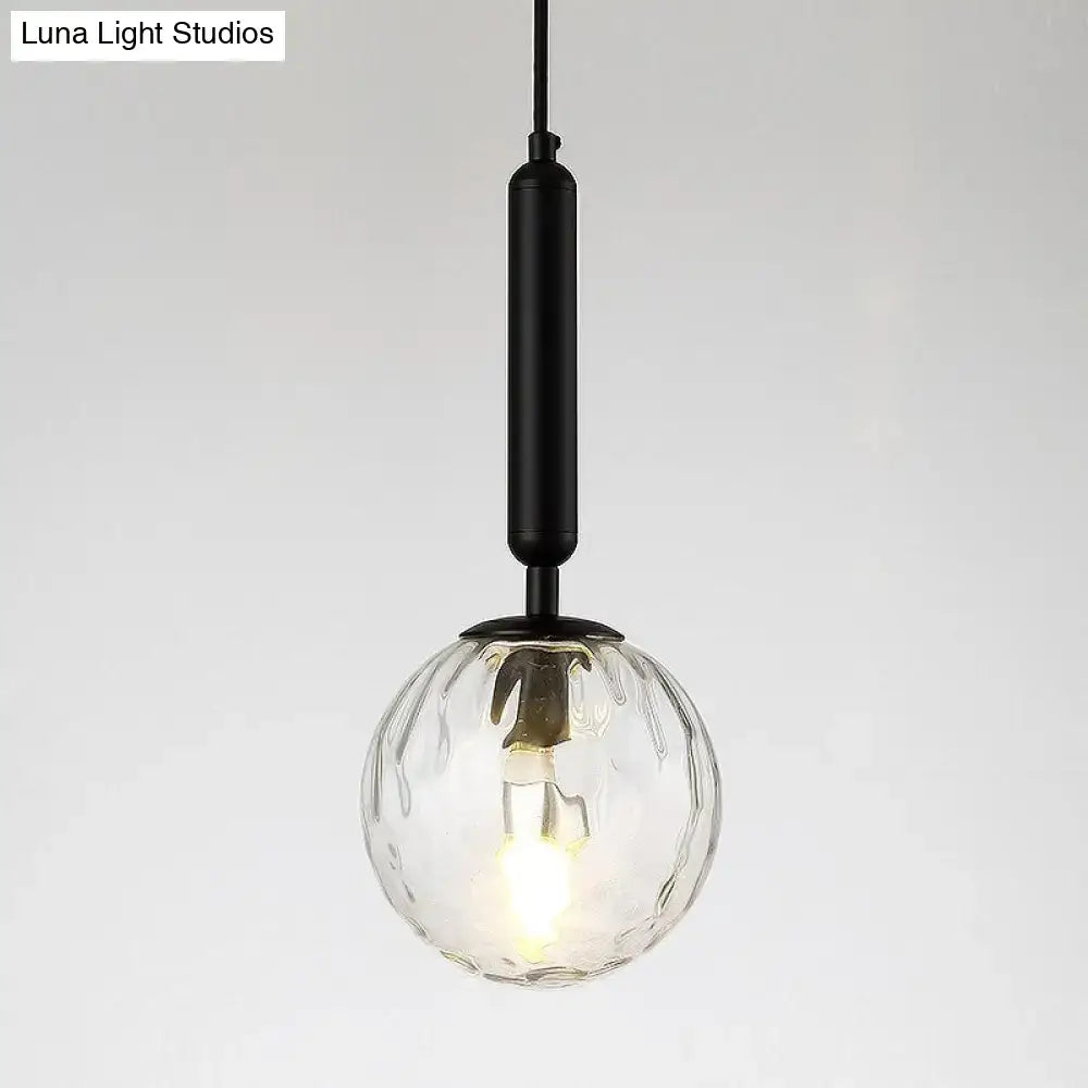 Black Glass Globe Wall Sconce with ribbed glass globe and black metal stem on Tampa Home & Garden Store