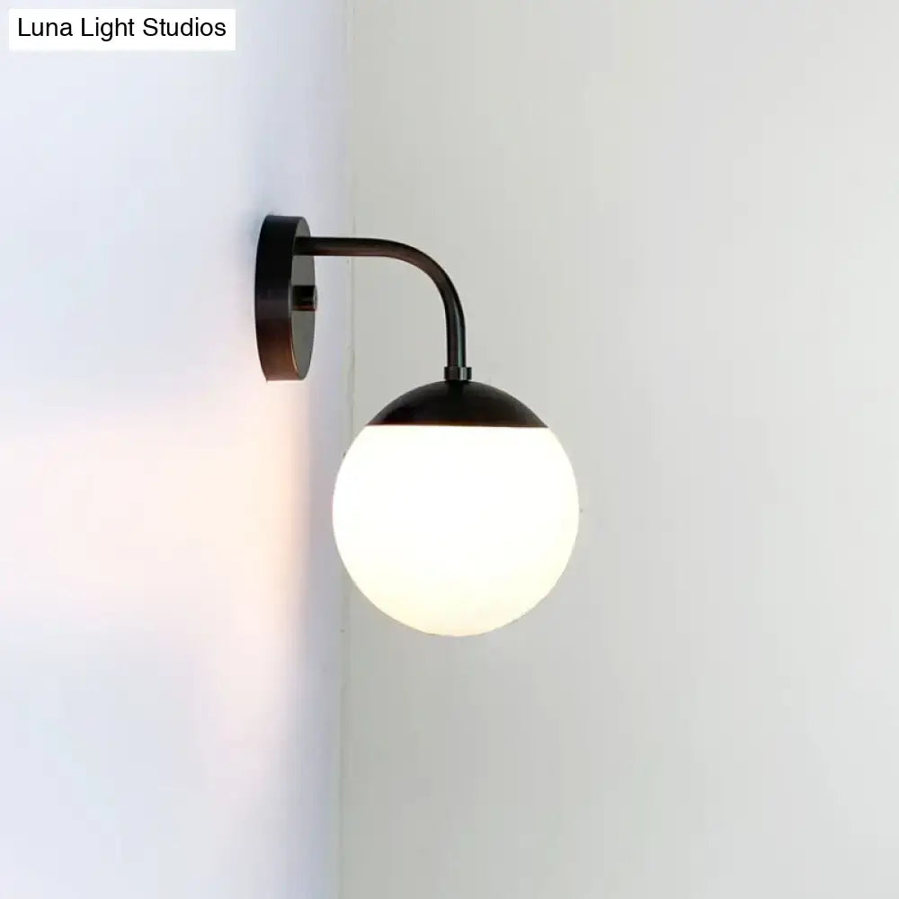 Milky Glass Ball Wall Lamp by Decorbites, black metal arm, wall-mounted on Tampa Home & Garden Store