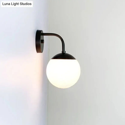 Milky Glass Ball Wall Lamp by Decorbites, black metal arm, wall-mounted on Tampa Home & Garden Store