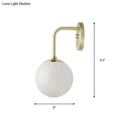 Milky Glass Ball Wall Lamp with brass curved arm and white glass shade by Decorbites on Tampa Home & Garden Store