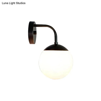 Milky glass ball wall lamp with curved black arm and wall mount Decorbites on Tampa Home & Garden Store