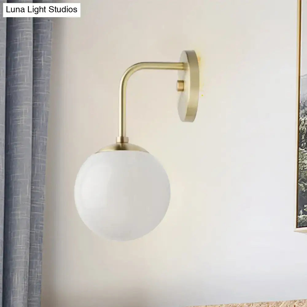 Milky glass ball wall lamp with brass arc and round wall mount by Decorbites on Tampa Home & Garden Store