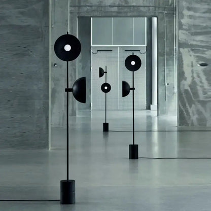 Three minimalist black marble floor lamps with funnel shade by Decorbites for living room on Tampa Home & Garden Store