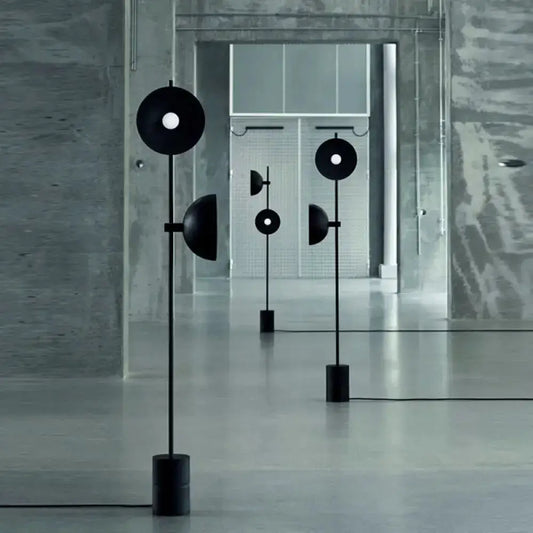 Three minimalist black marble floor lamps with funnel shade by Decorbites for living room on Tampa Home & Garden Store