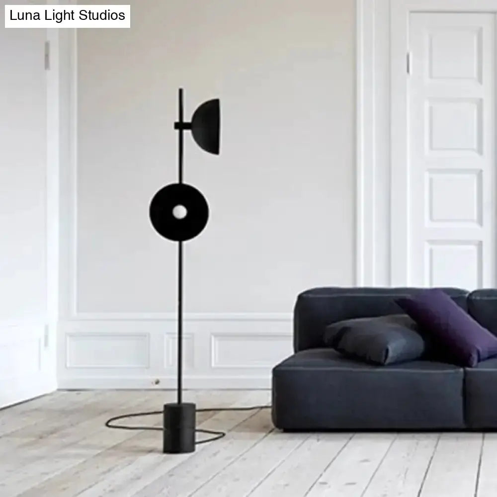 Minimalist black marble floor lamp with funnel shade Decorbites in living room on Tampa Home & Garden Store