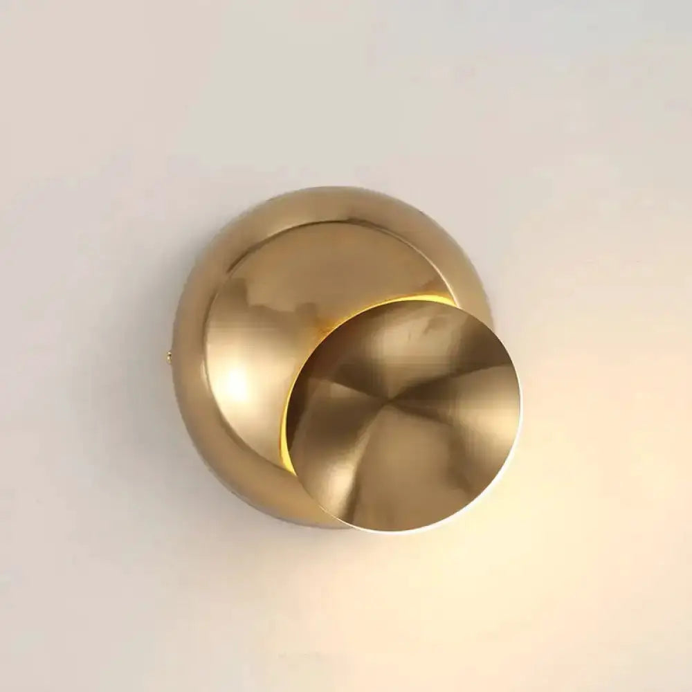 Minimalist moon-shaped brass wall sconce for bedroom lighting on Tampa Home & Garden Store