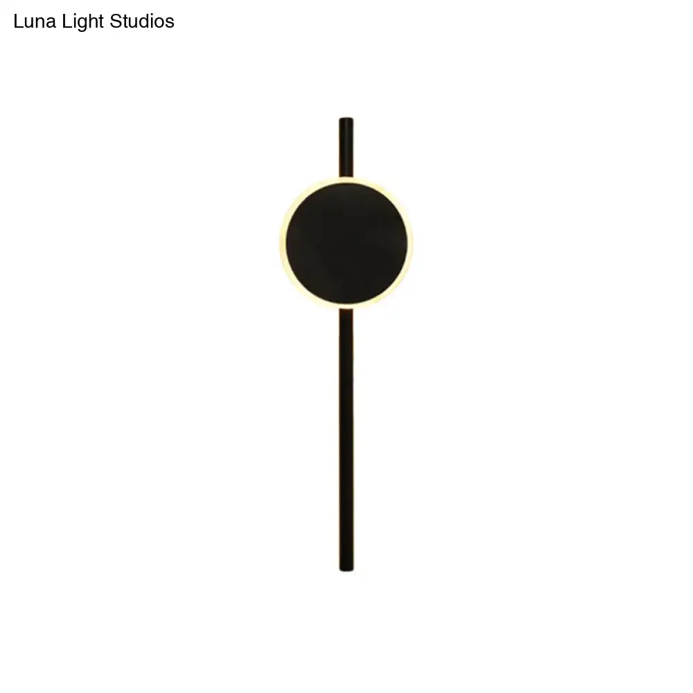 Black LED flush wall sconce with circular black panel and slim vertical mount on Tampa Home & Garden Store