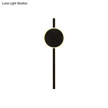 Black LED flush wall sconce with circular black panel and slim vertical mount on Tampa Home & Garden Store