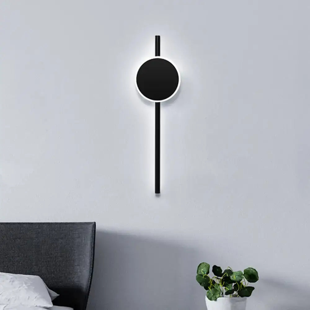 Black LED flush wall sconce by Decorbites, round black disc on a vertical rod, wall mount on Tampa Home & Garden Store