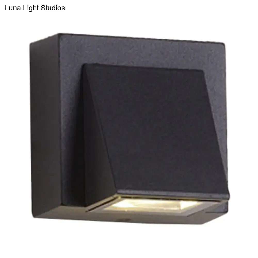 Black triangle wall lamp by Decorbites, modern metal wall sconce with square backplate on Tampa Home & Garden Store