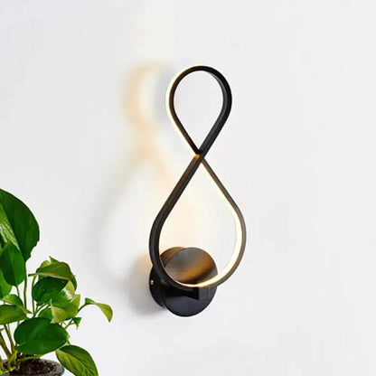 Minimalist black & white acrylic LED wall lamp sconce by Decorbites with looped infinity design on Tampa Home & Garden Store
