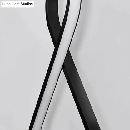 Minimalist black and white acrylic LED wall lamp sconce with twisting loops Decorbites on Tampa Home & Garden Store