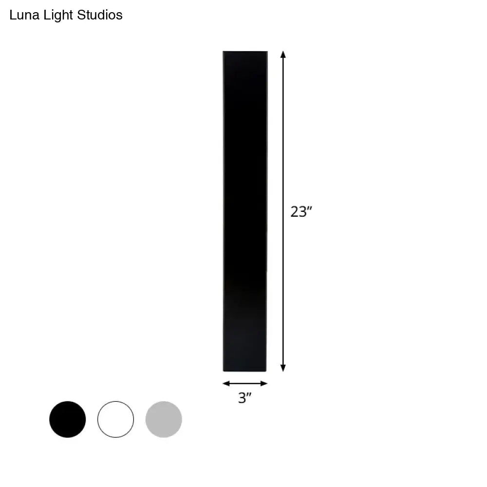 White aluminum wall sconce by Decorbites, 23in tall, 3in wide; finish swatches black, white, gray on Tampa Home & Garden Store