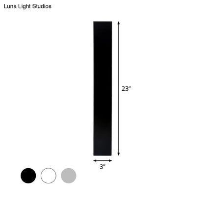 White aluminum wall sconce by Decorbites, 23in tall, 3in wide; finish swatches black, white, gray on Tampa Home & Garden Store
