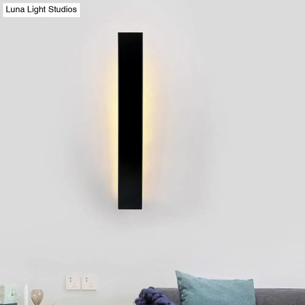 White aluminum wall sconce, slim vertical rectangular design with warm edge glow, Decorbites on Tampa Home & Garden Store