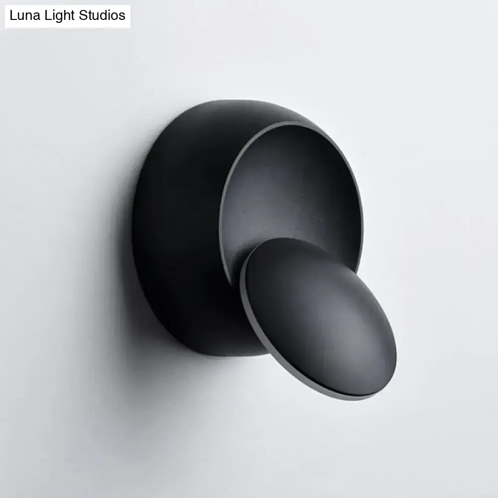 Black circular LED stairway wall lamp by Decorbites with round backplate and disk shade on Tampa Home & Garden Store