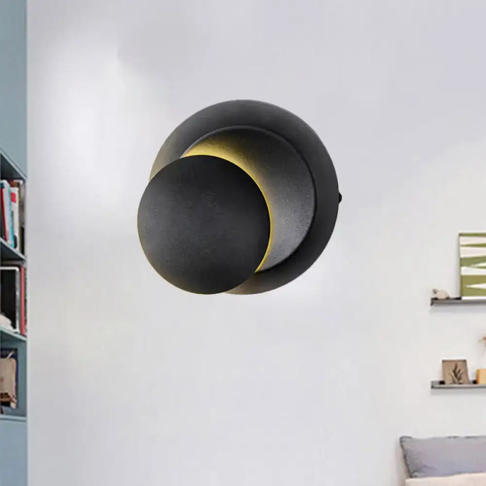 Black circular LED stairway wall lamp by Decorbites with overlapping discs and warm glow on Tampa Home & Garden Store