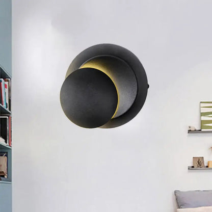 Black circular LED stairway wall lamp by Decorbites with overlapping discs and warm glow on Tampa Home & Garden Store