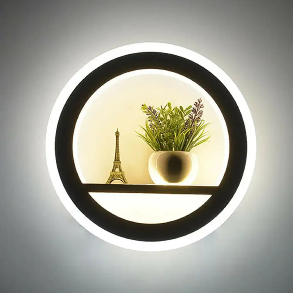 White circular LED sconce by Decorbites with black inner ring and Eiffel Tower plant shelf on Tampa Home & Garden Store