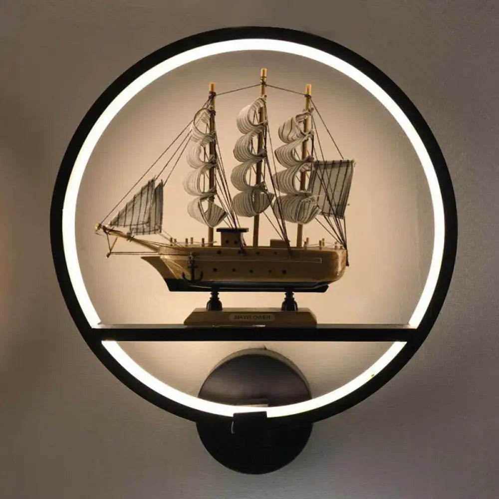 White circular LED sconce featuring a nautical ship display inside a round wall mount on Tampa Home & Garden Store