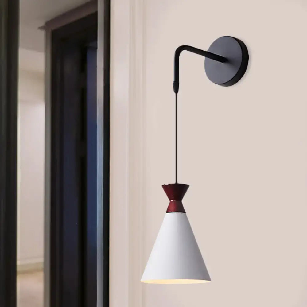 Black conical iron minimalist sconce by Decorbites, wall-mounted with a white shade on Tampa Home & Garden Store
