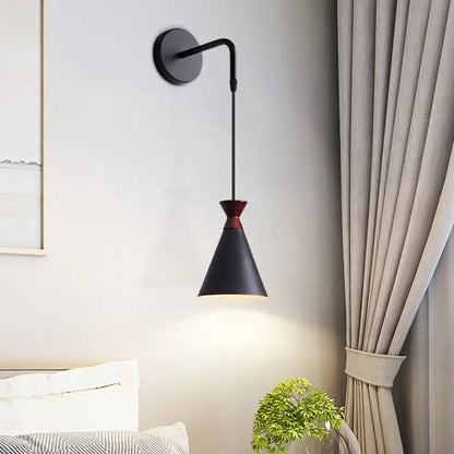 Black conical iron minimalist sconce by Decorbites, wall-mounted with red accent on Tampa Home & Garden Store