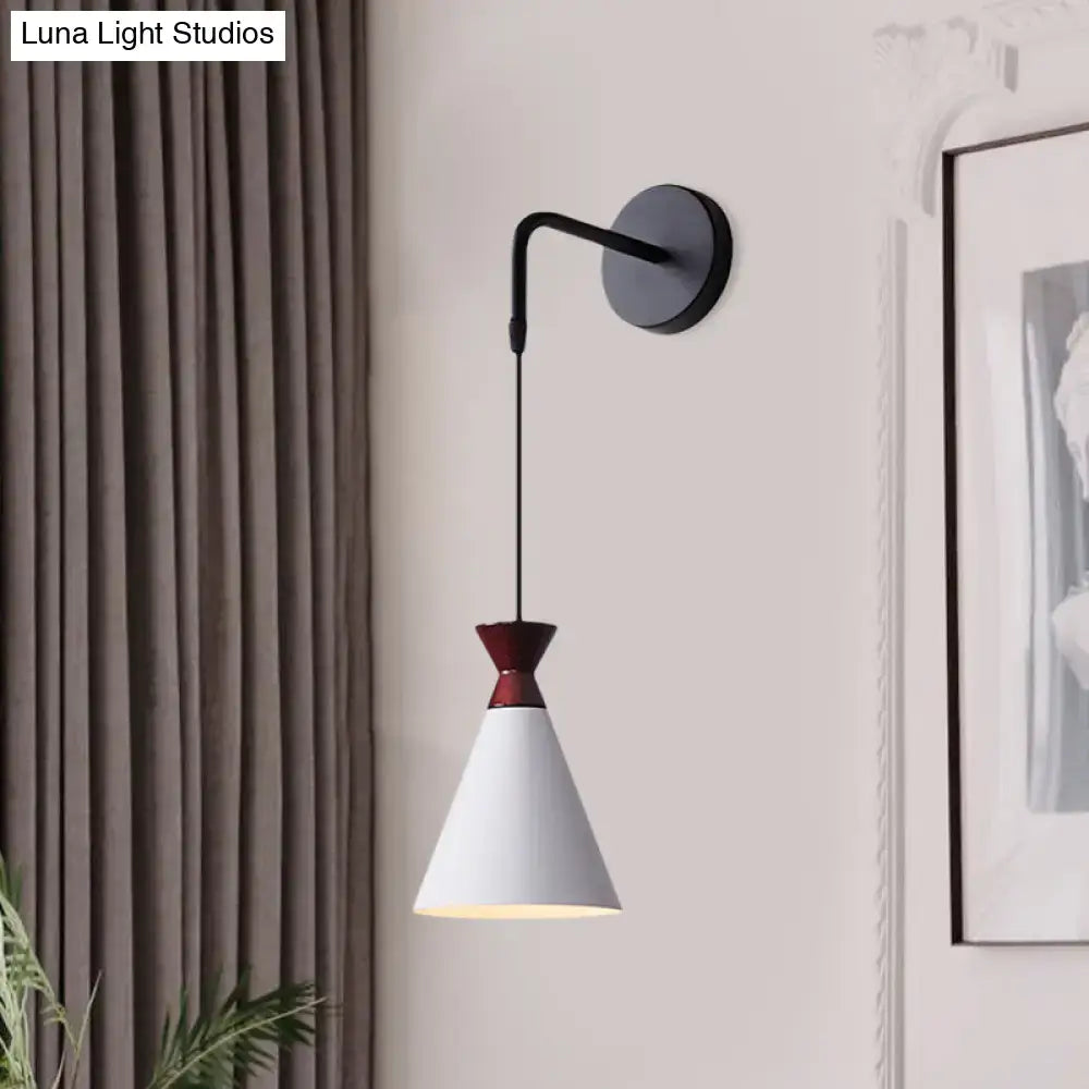 Black conical iron minimalist sconce with white shade and red neck, wall mounted on Tampa Home & Garden Store
