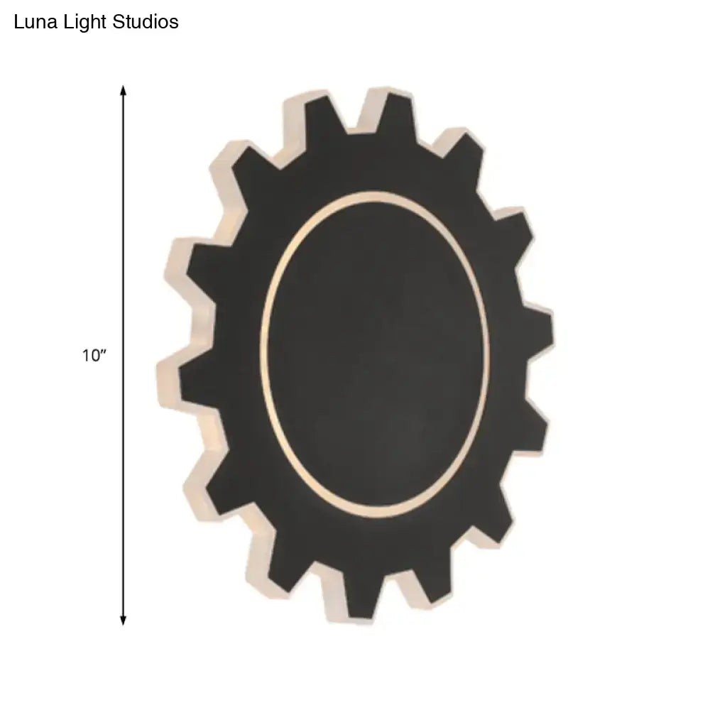 Decorbites black modern wall sconce with gear-shaped silhouette and oval light opening on Tampa Home & Garden Store