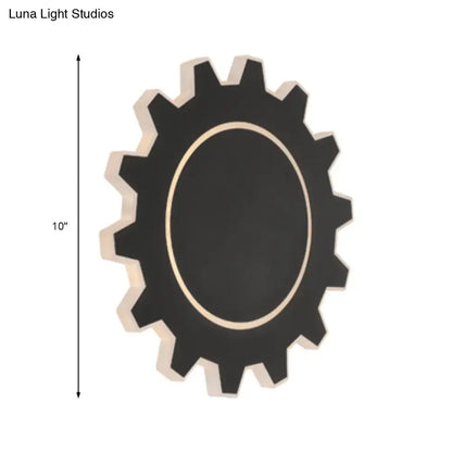 Decorbites black modern wall sconce with gear-shaped silhouette and oval light opening on Tampa Home & Garden Store