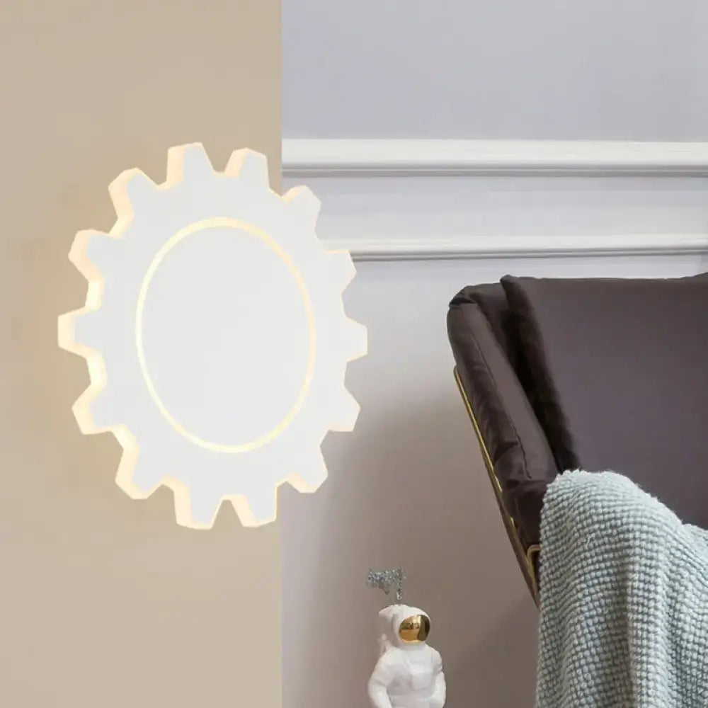 Black acrylic dimmable wall sconce with gear silhouette and circular LED glow by Decorbites on Tampa Home & Garden Store