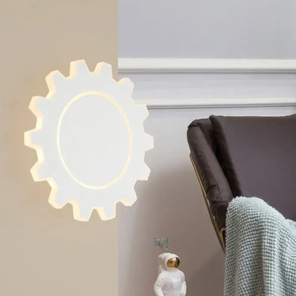 Black acrylic dimmable wall sconce with gear silhouette and circular LED glow by Decorbites on Tampa Home & Garden Store