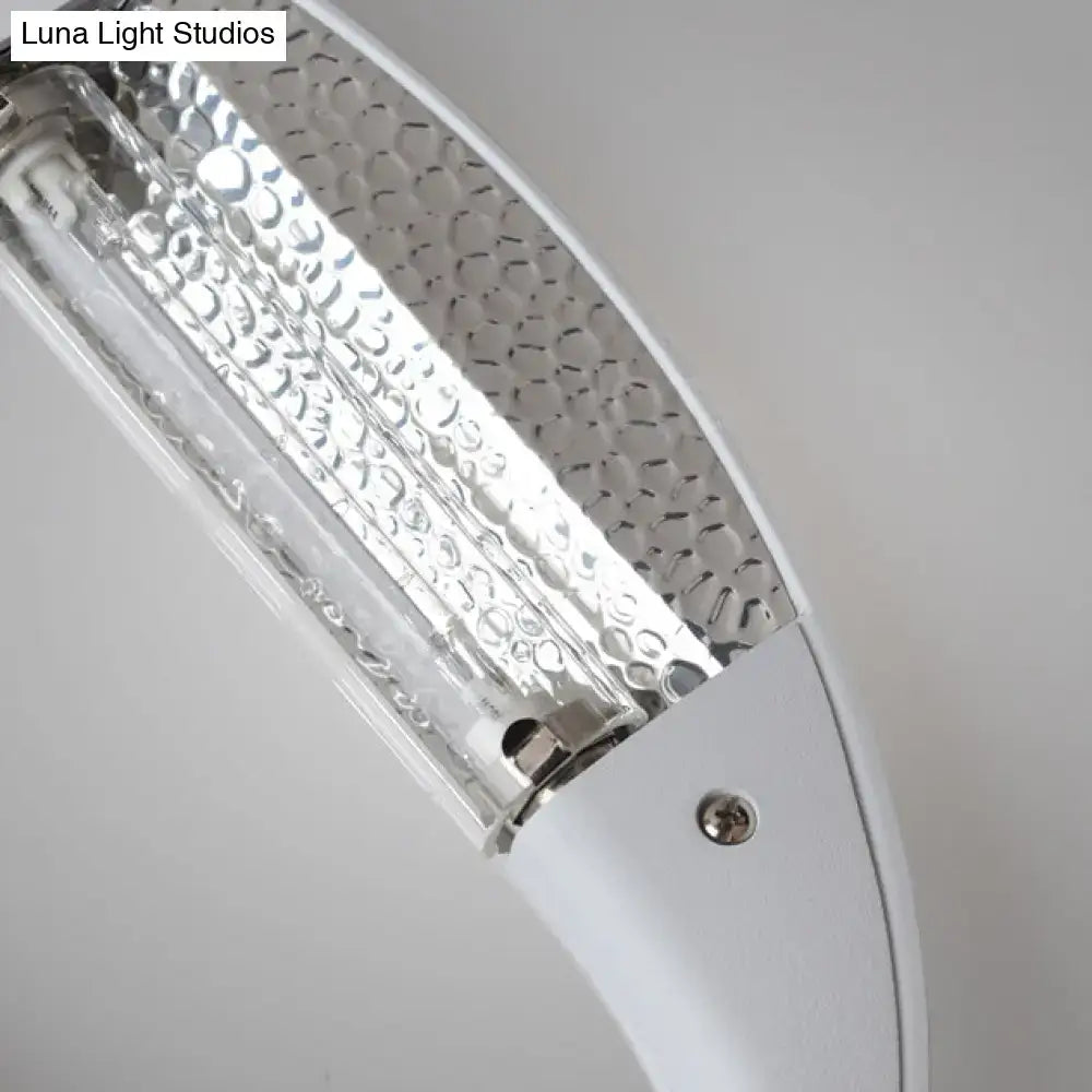 Black oval aluminum LED wall sconce with silver textured reflector panel by Decorbites on Tampa Home & Garden Store