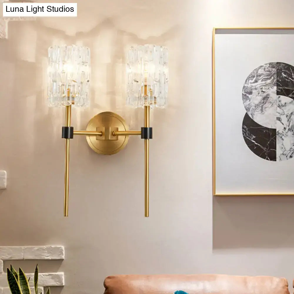 Decorbites brass crystal wall sconce with slender glass cylinder shades and dual arms on Tampa Home & Garden Store