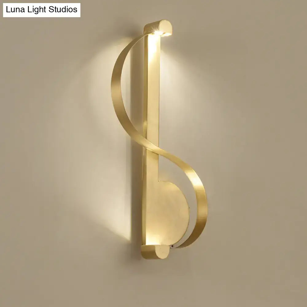 Brass Curve Wall Light by Decorbites, ribbon-brass wall sconce with warm glow on Tampa Home & Garden Store