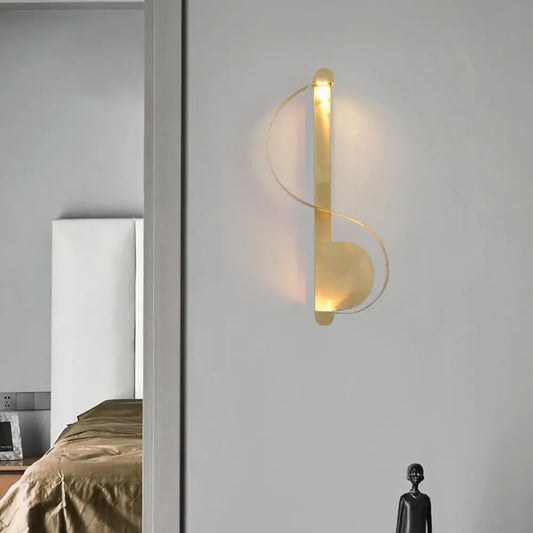 Brass Curve Wall Light modern brass wall sconce with looping rings and warm glow on Tampa Home & Garden Store
