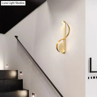 Brass Curve Wall Light by Decorbites, curved loop brass fixture warms stairs area on Tampa Home & Garden Store