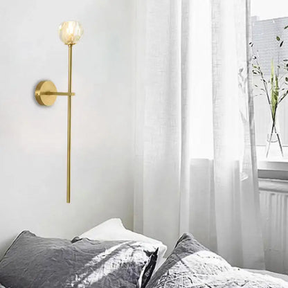 Decorbites brass crystal wall sconce with slender stem and faceted globe shade on wall on Tampa Home & Garden Store