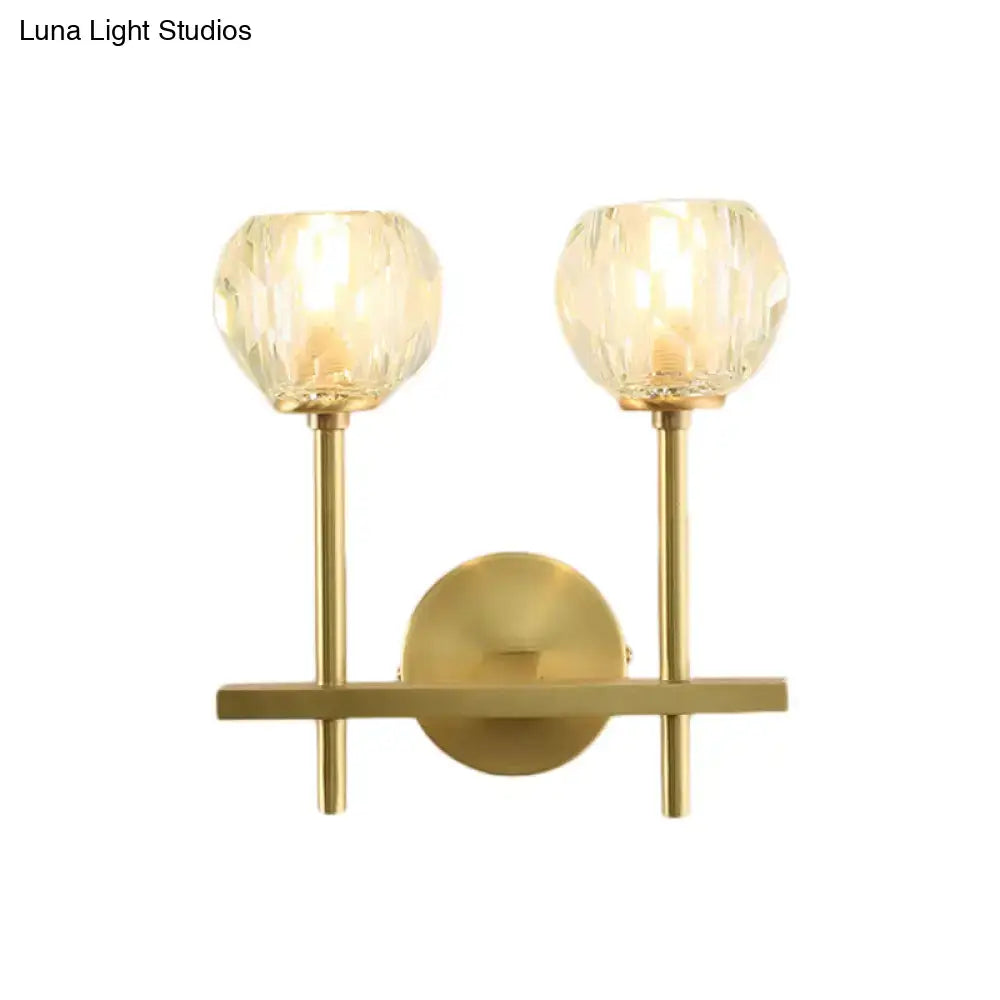 Brass crystal wall sconce with dual glass orb shades and gold posts on Tampa Home & Garden Store