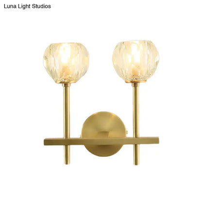 Brass crystal wall sconce with dual glass orb shades and gold posts on Tampa Home & Garden Store