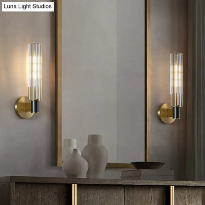 Brass tubular wall sconces pair with glass cylinder shades and black socket details by Decorbites on Tampa Home & Garden Store