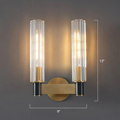 Brass tubular wall sconce with glass tube shades, gold finish, 13 in high by 9 in wide on Tampa Home & Garden Store