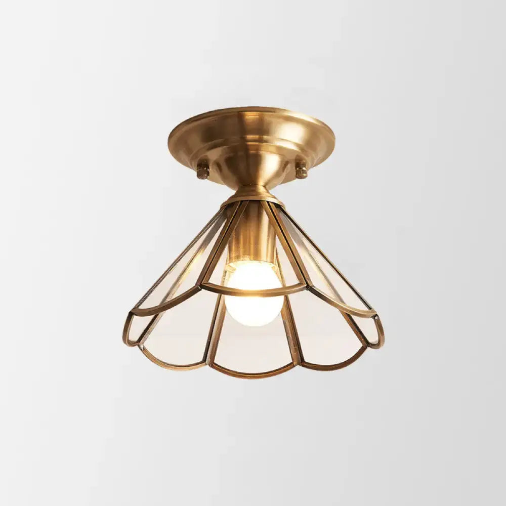Brass scalloped flush mount light with geometric metal shade and exposed bulb Decorbites on Tampa Home & Garden Store