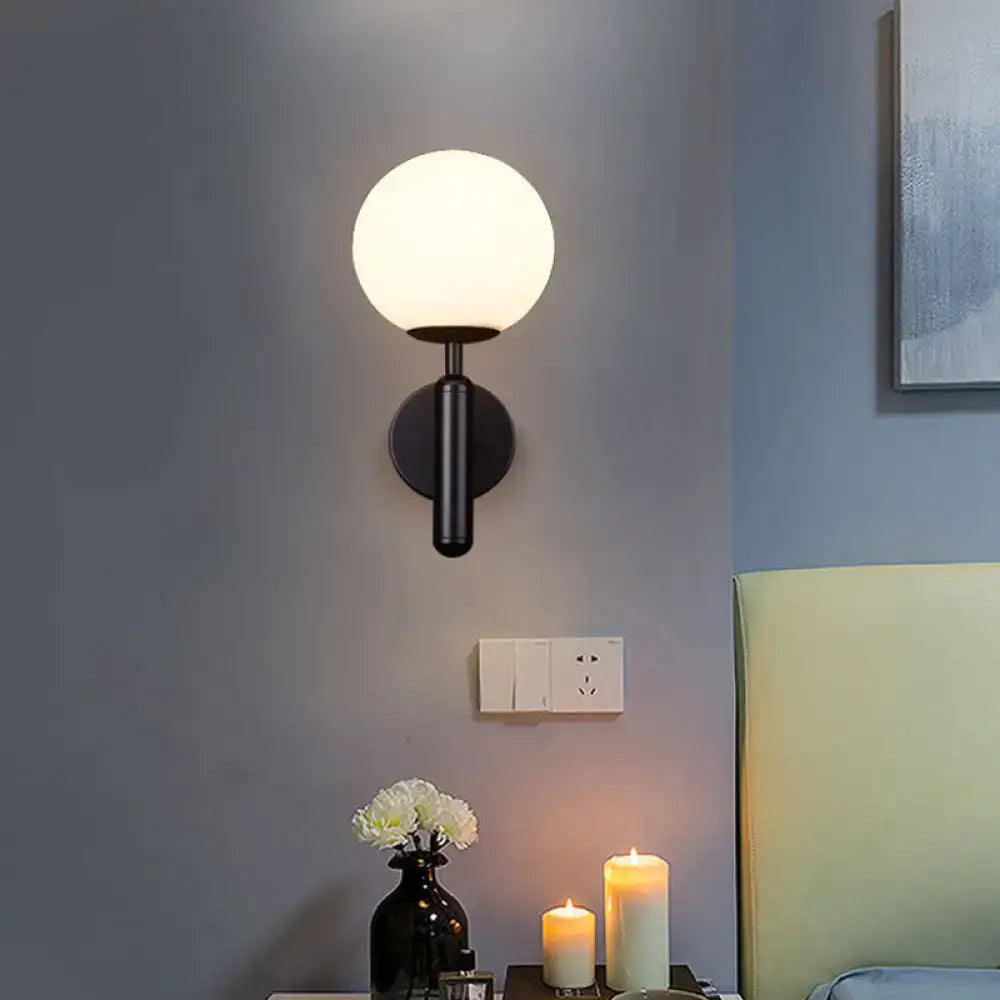 Black Gold Glass Globe Sconce by Decorbites; black metal wall light with white globe on Tampa Home & Garden Store